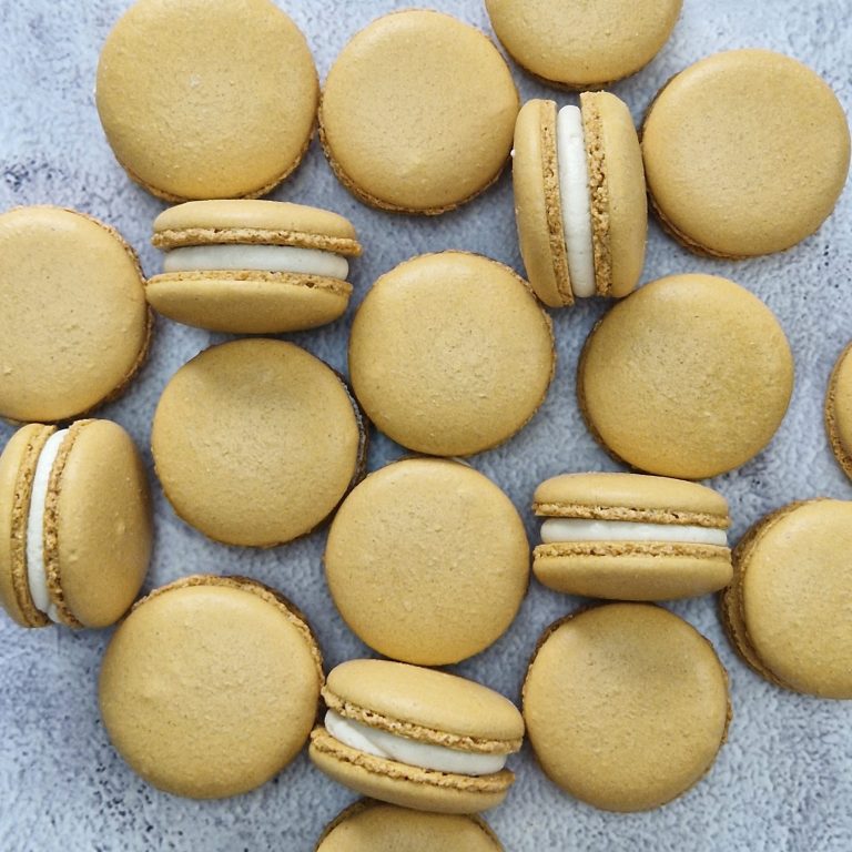 Tan coloured Salted Caramel Macarons with Salted Caramel and Vanilla Buttercream